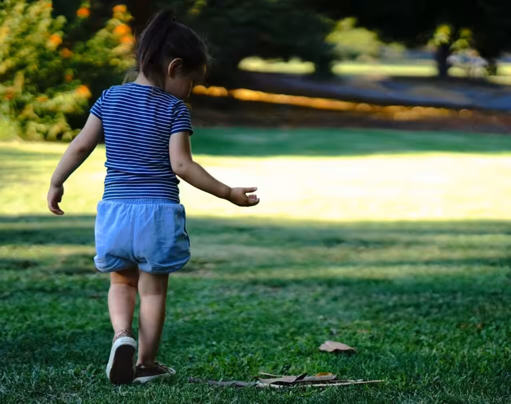 child in a park walking