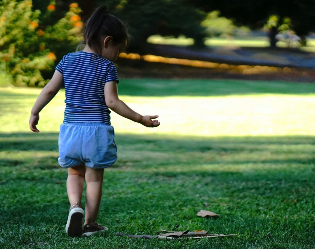 child in a park walking