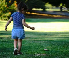 child in a park walking
