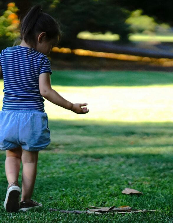 child in a park walking