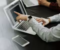 person sitting infront of a laptop