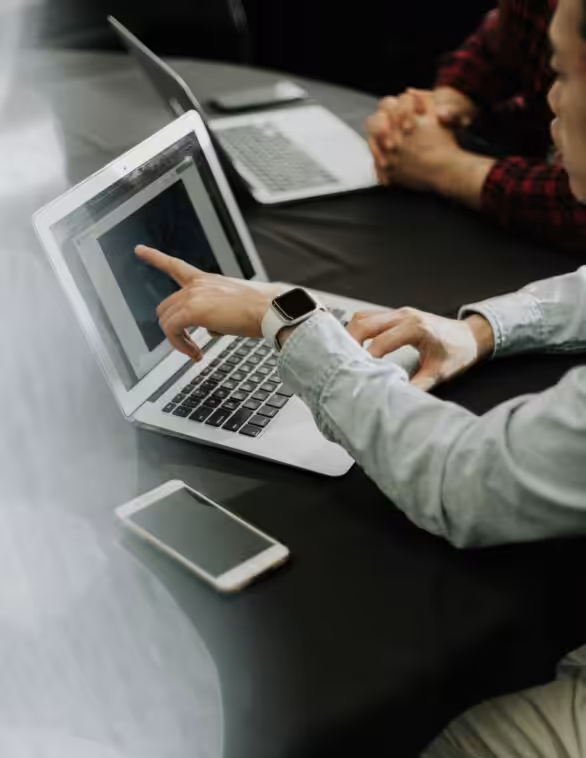 person sitting infront of a laptop