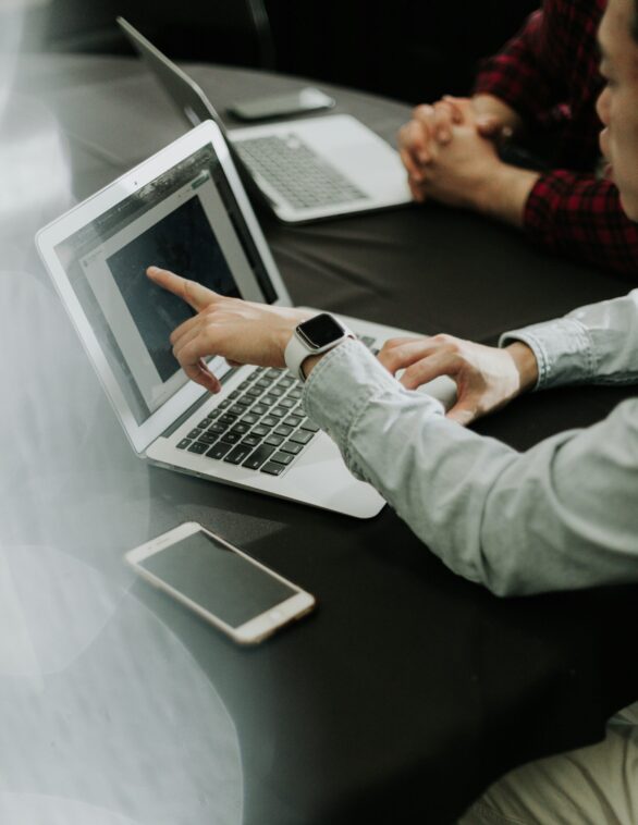 person sitting infront of a laptop