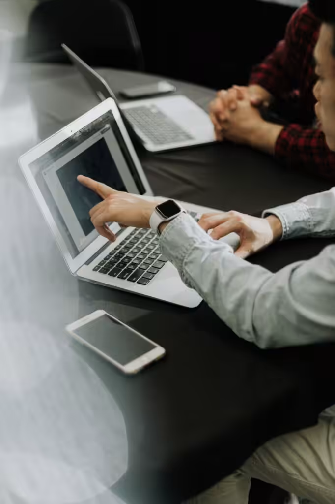 person sitting infront of a laptop