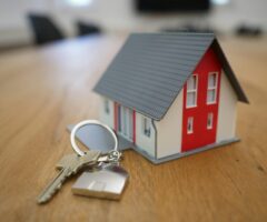 a miniature house and keys