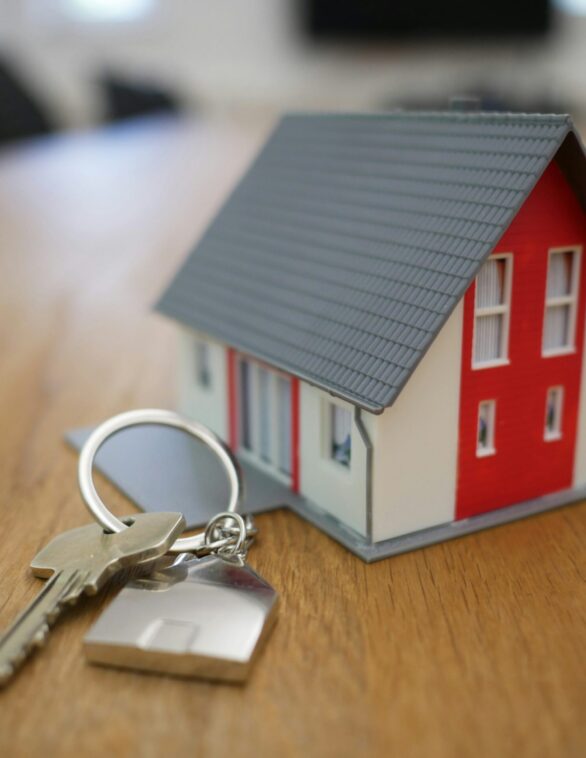 a miniature house and keys